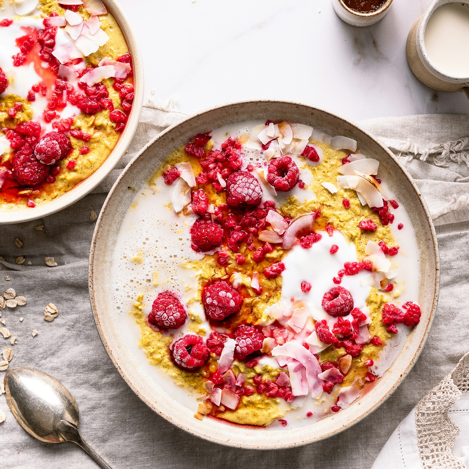 Golden Milk Porridge with Raspberries & Toasted Coconut